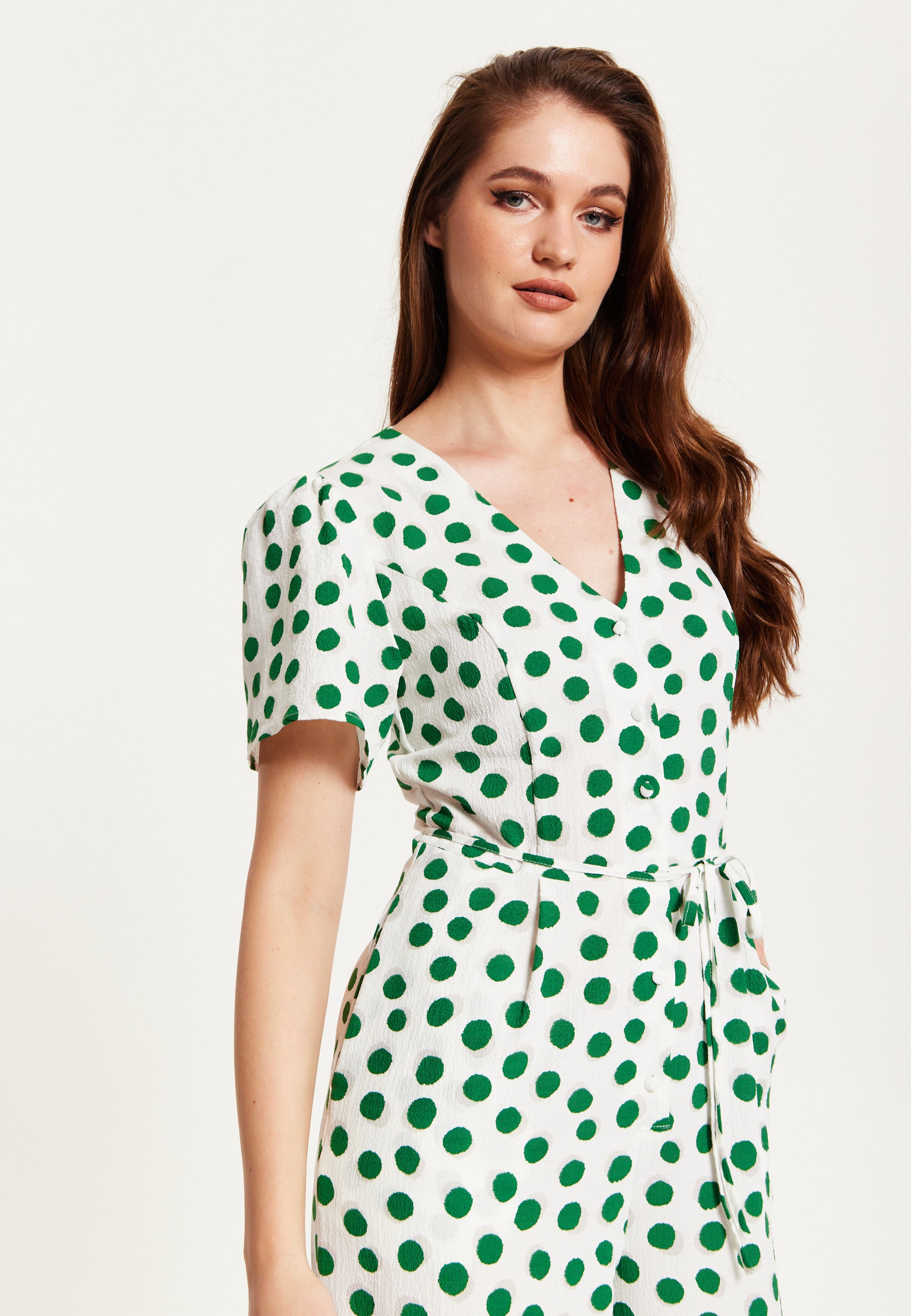 Women's Jumpsuit in White with Green Polka Dots, V Neck, Short Sleeves Liquorish Online Women's Jumpsuit in White with Green Polka Dots, V Neck, Short Sleeves Liquorish Online
