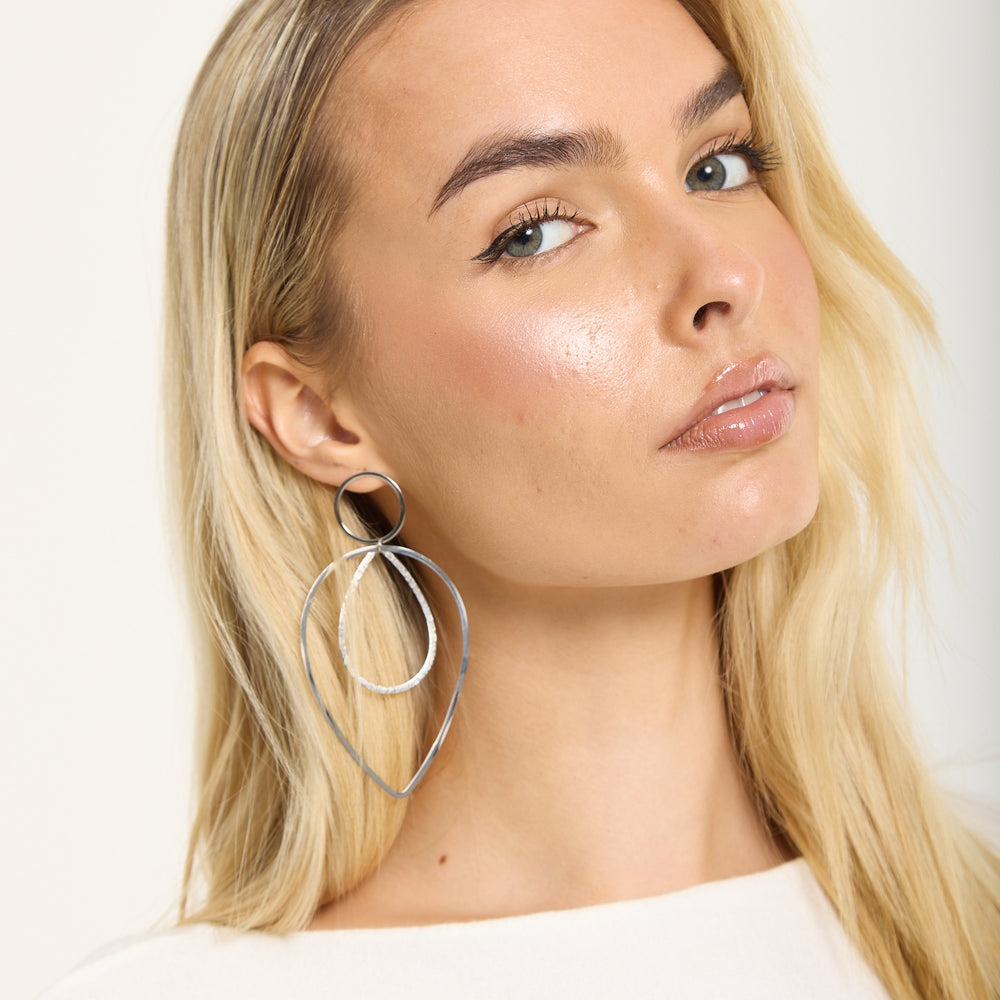 
                  
                    Silver Double Teardrop Metal Earrings
                  
                