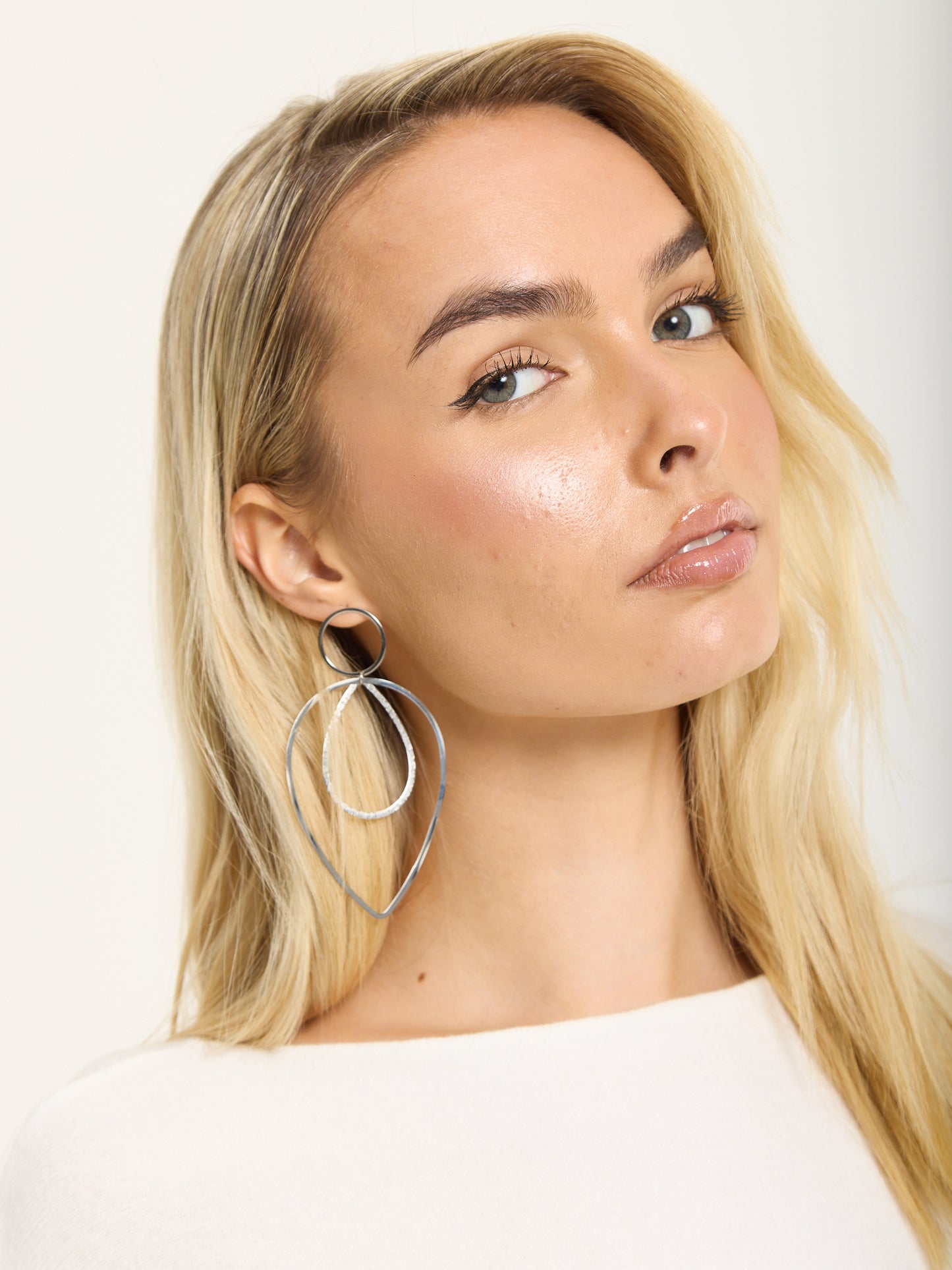 
                  
                    Silver Double Teardrop Metal Earrings
                  
                