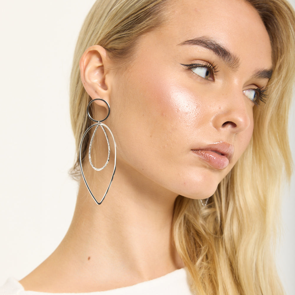 
                  
                    Silver Double Teardrop Metal Earrings
                  
                