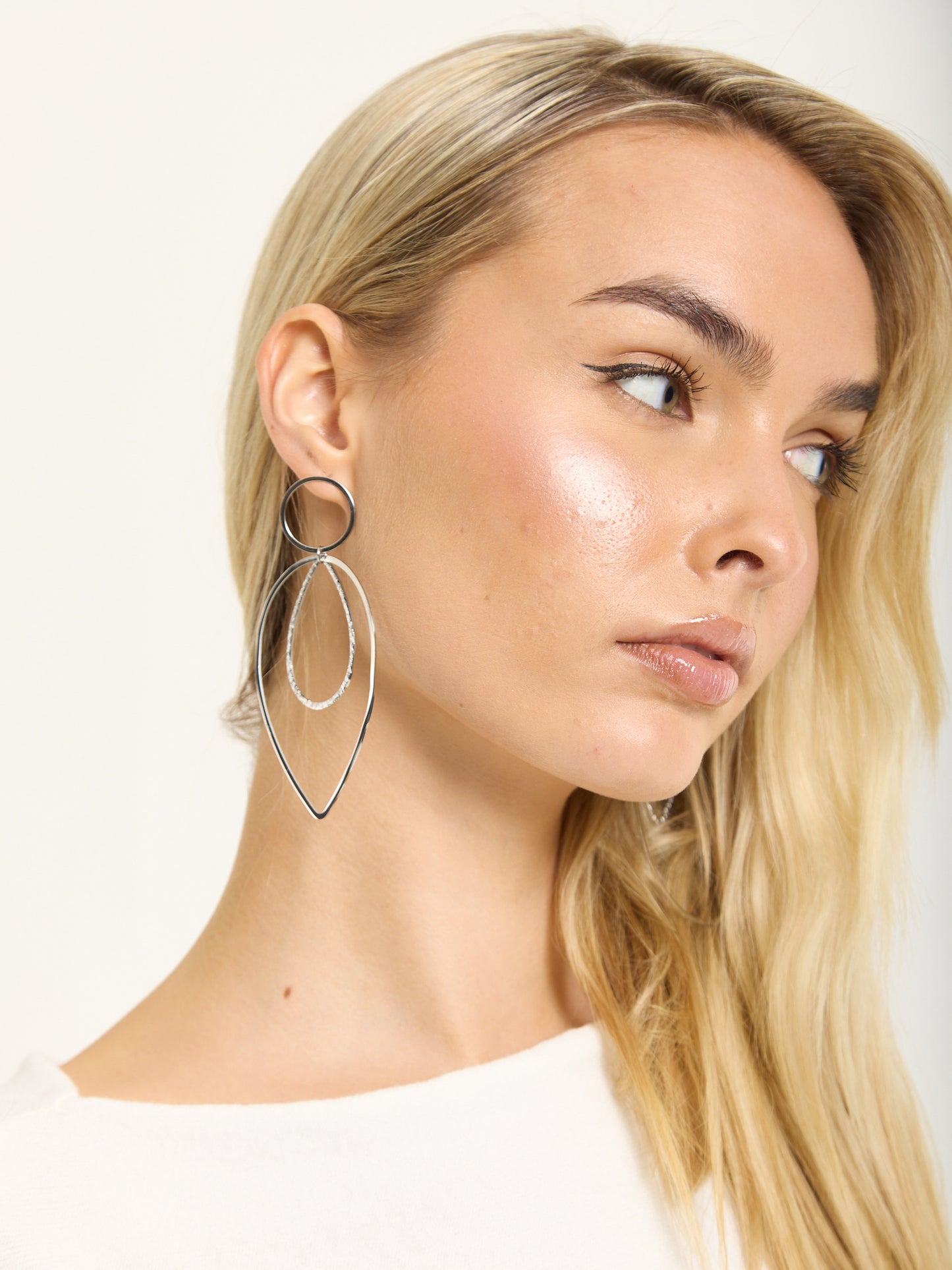 
                  
                    Silver Double Teardrop Metal Earrings
                  
                