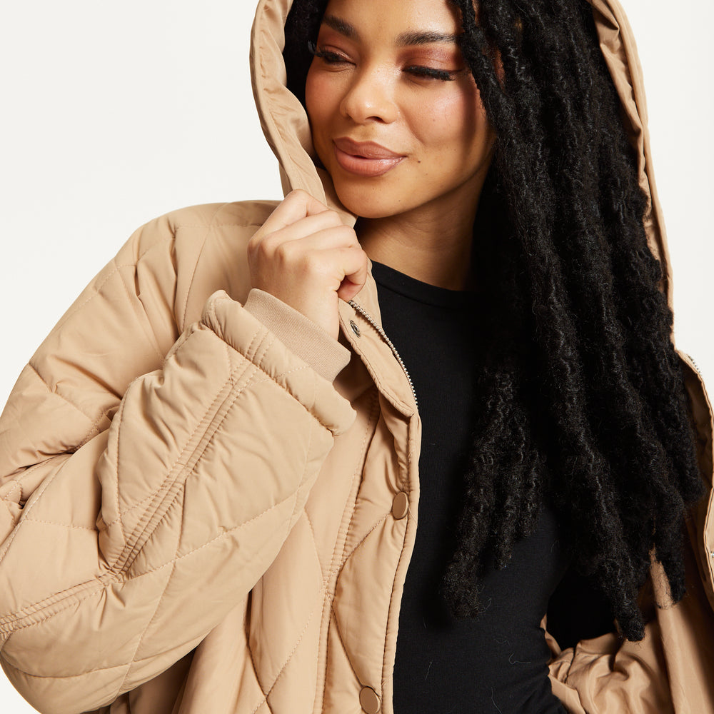
                  
                    Beige Quilted Hooded Coat
                  
                