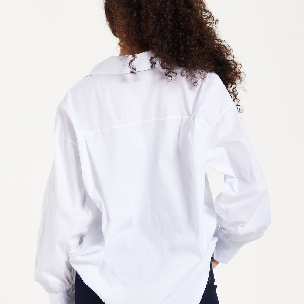 
                  
                    Liuqorish Oversized White Button-Down Shirt
                  
                