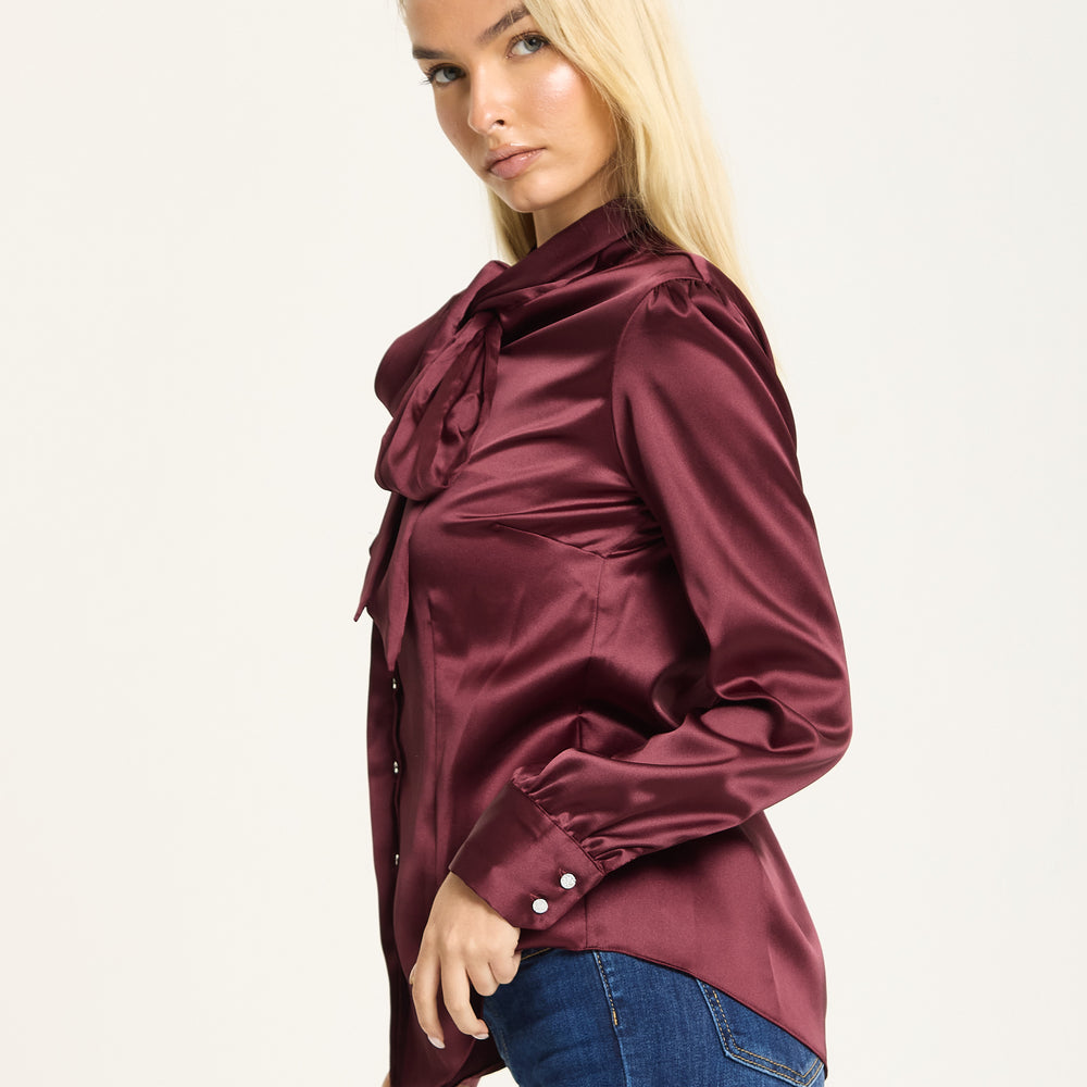 
                  
                    Wine Satin Pussybow Silver Button Shirt
                  
                