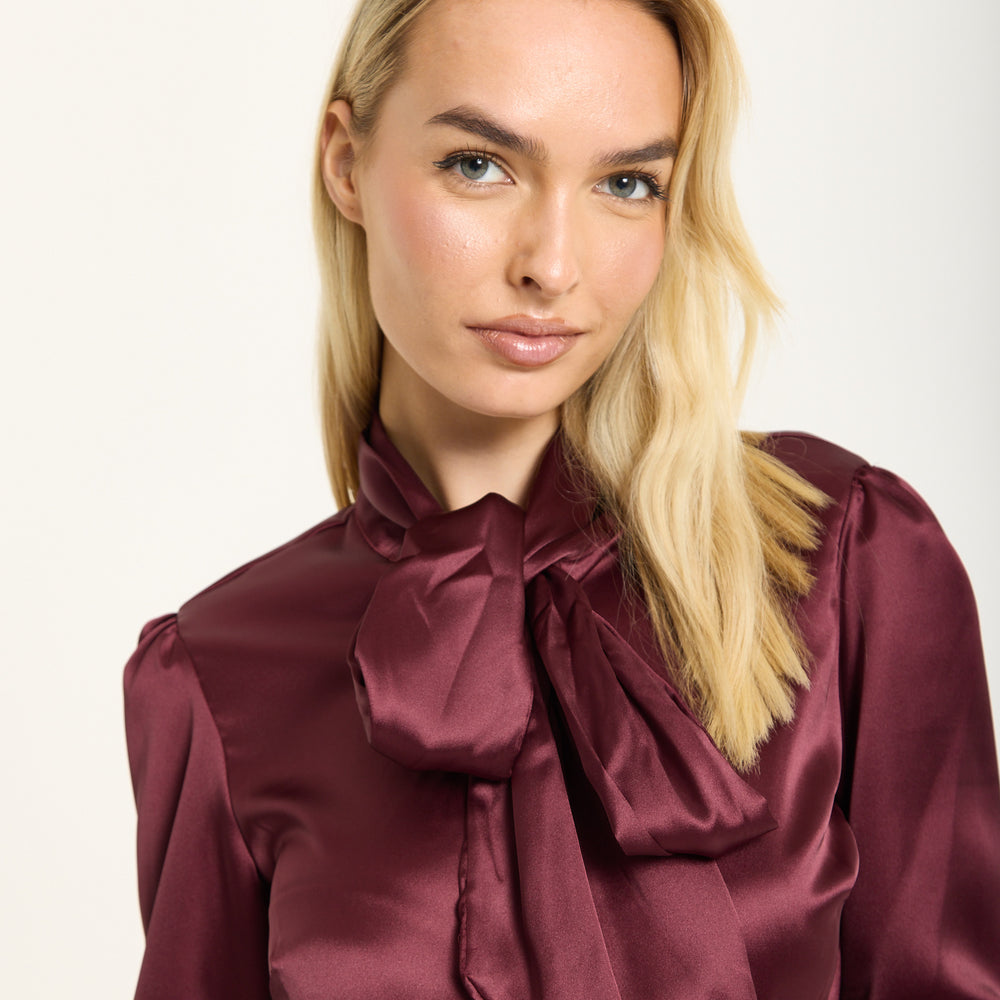 
                  
                    Wine Satin Pussybow Silver Button Shirt
                  
                