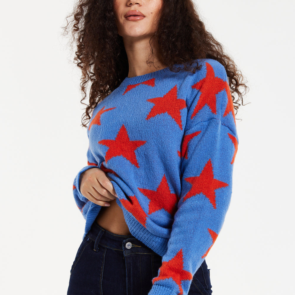 
                  
                    Women's Jumper in Blue with Full-Length Sleeves and Unique Red Star Pattern
                  
                