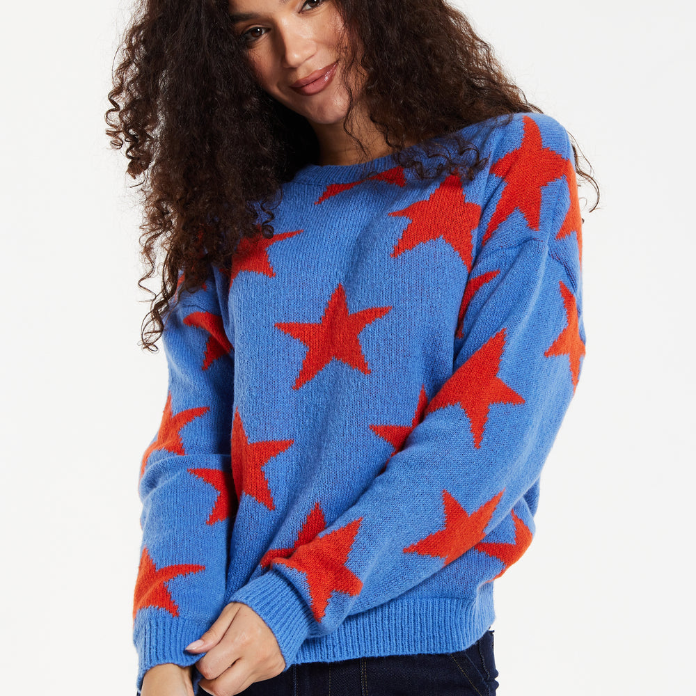 
                  
                    Women's Jumper in Blue with Full-Length Sleeves and Unique Red Star Pattern
                  
                