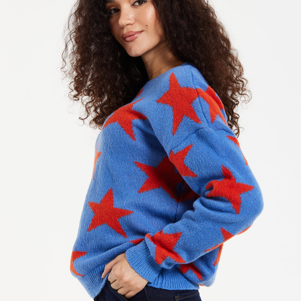 
                  
                    Women's Jumper in Blue with Full-Length Sleeves and Unique Red Star Pattern
                  
                