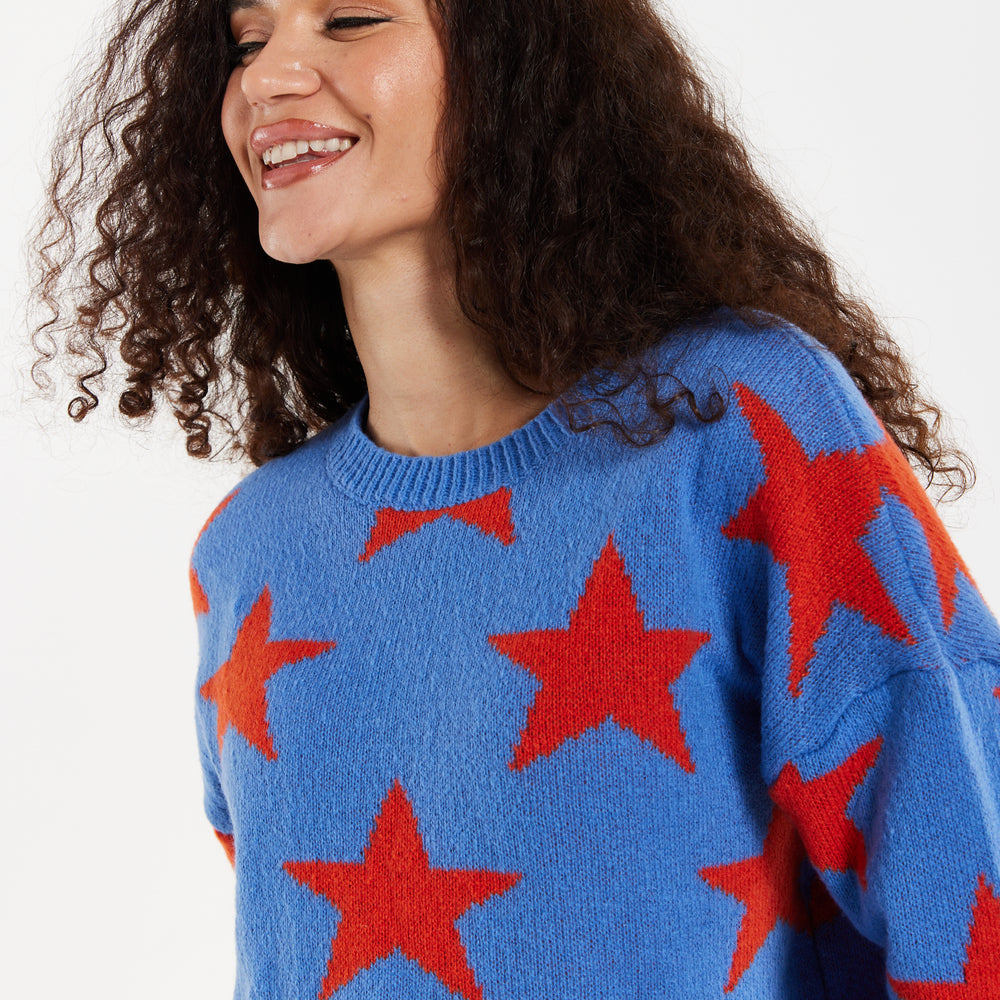 
                  
                    Women's Jumper in Blue with Full-Length Sleeves and Unique Red Star Pattern
                  
                