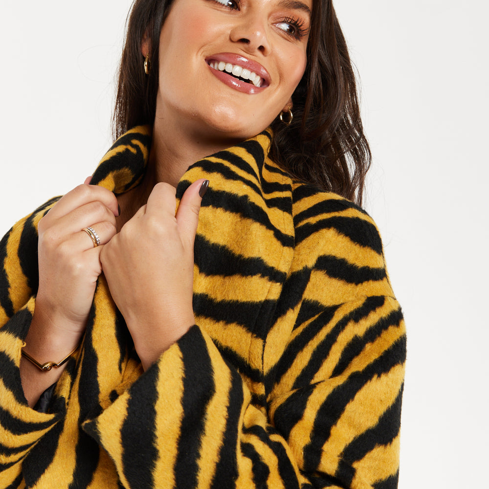 
                  
                    Liquorish Zebra Print Longline Coat In Mustard And Black
                  
                