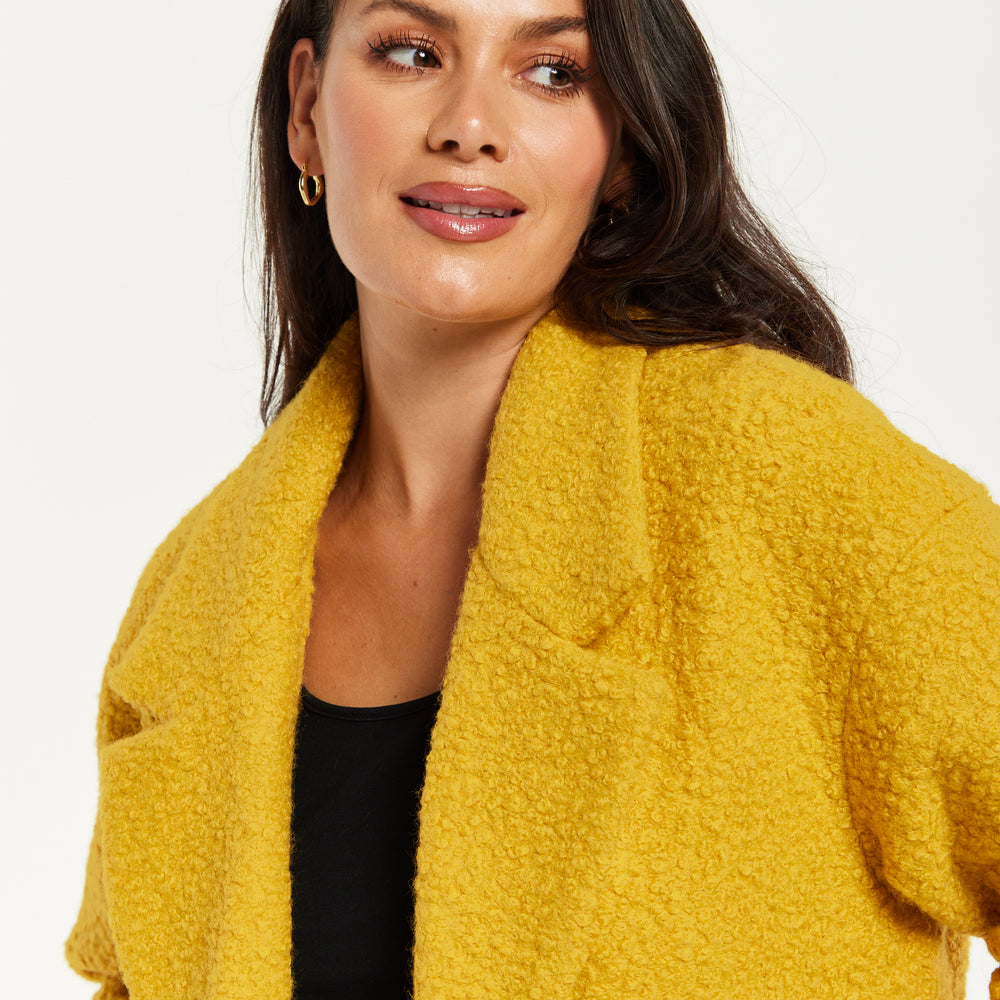 
                  
                    Liquorish Classic Mustard Yellow Bouclè Coat with Notched Lapels
                  
                