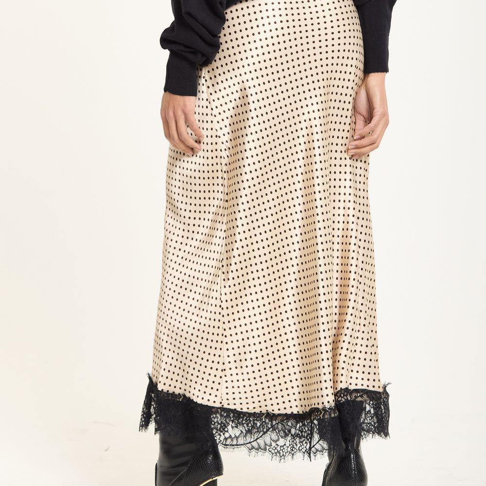 
                  
                    Beige Polka Dot Skirt with Black Lace Trim
                  
                