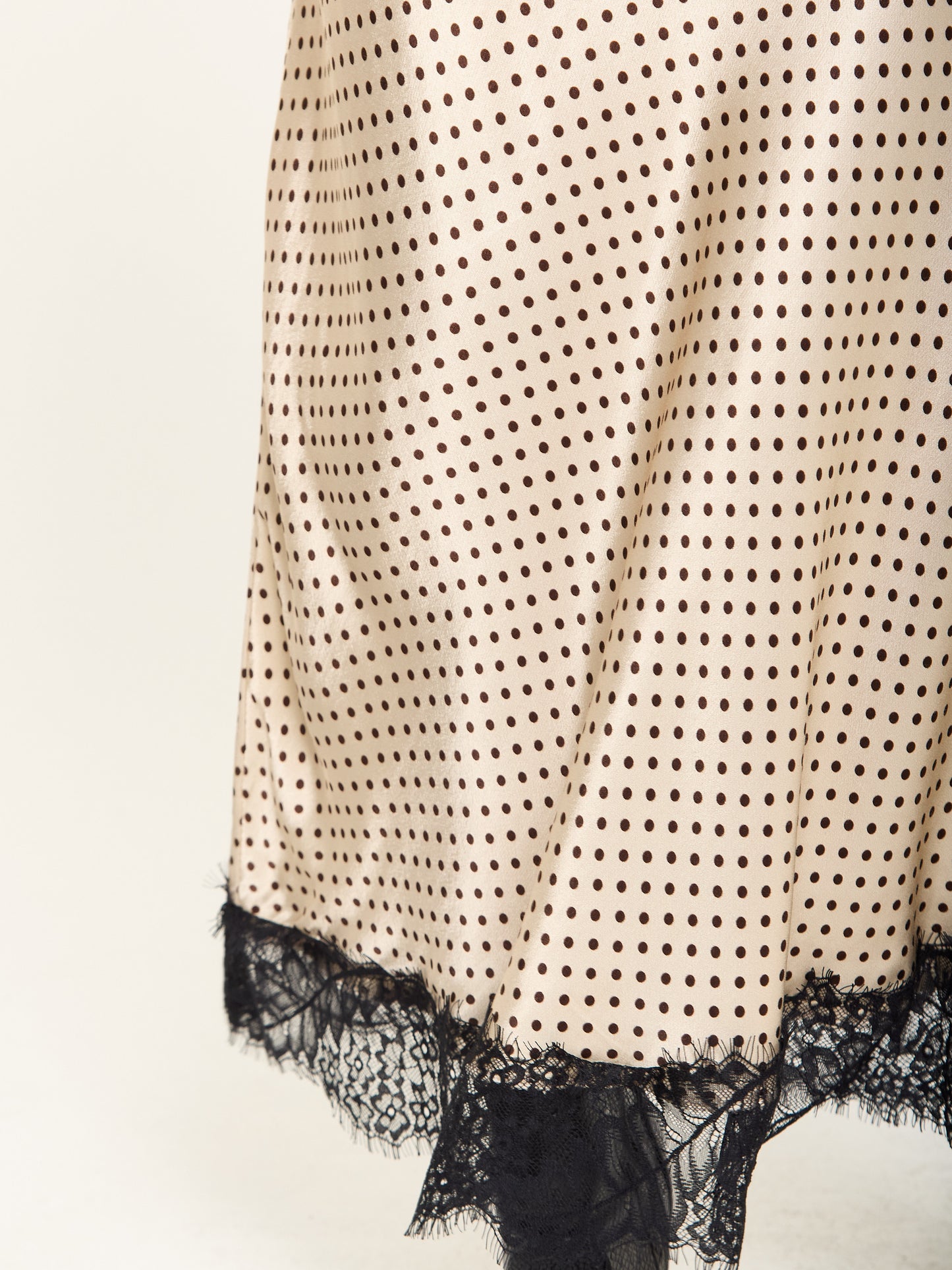
                  
                    Beige Polka Dot Skirt with Black Lace Trim
                  
                