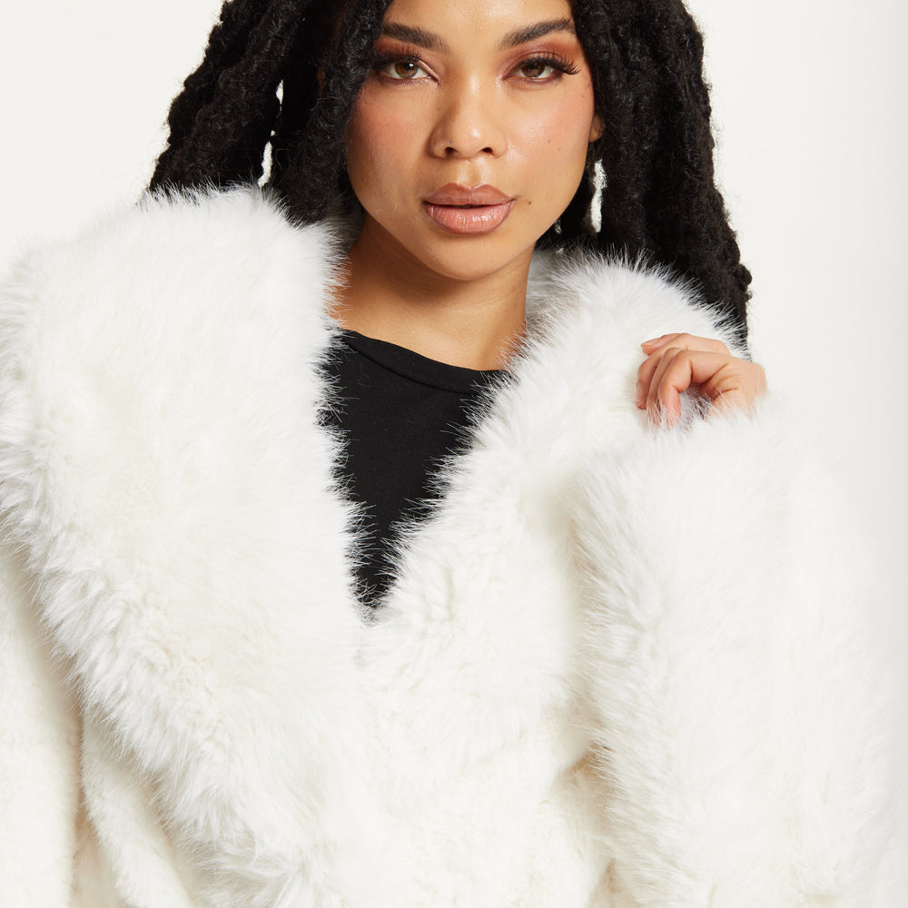 
                  
                    Faux Fur Coat in White
                  
                