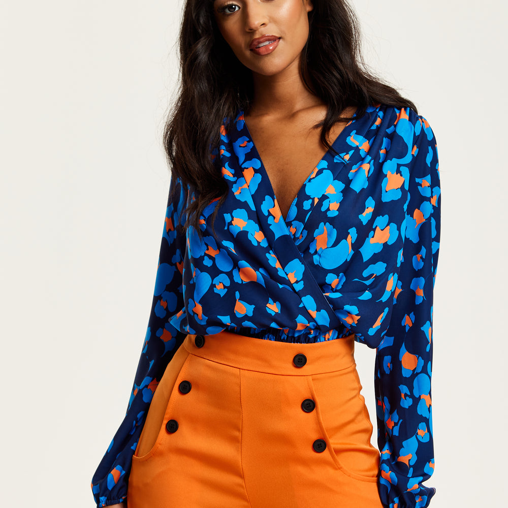 
                  
                    Liquorish Abstract Print Wrap Top In Pink Orange And Blue
                  
                