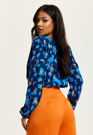 Liquorish Abstract Print Wrap Top In Pink Orange And Blue
