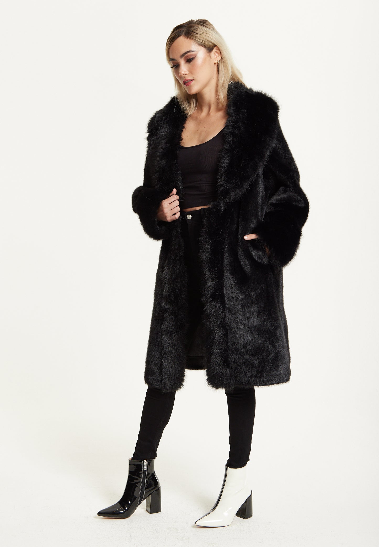 
                  
                    Long Faux Fur Coat in Black
                  
                