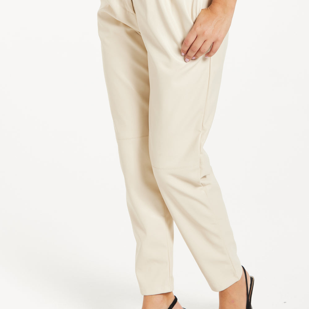 
                  
                    Liquorish Tapered Leather Look Trousers with Pleated Detail in Cream
                  
                