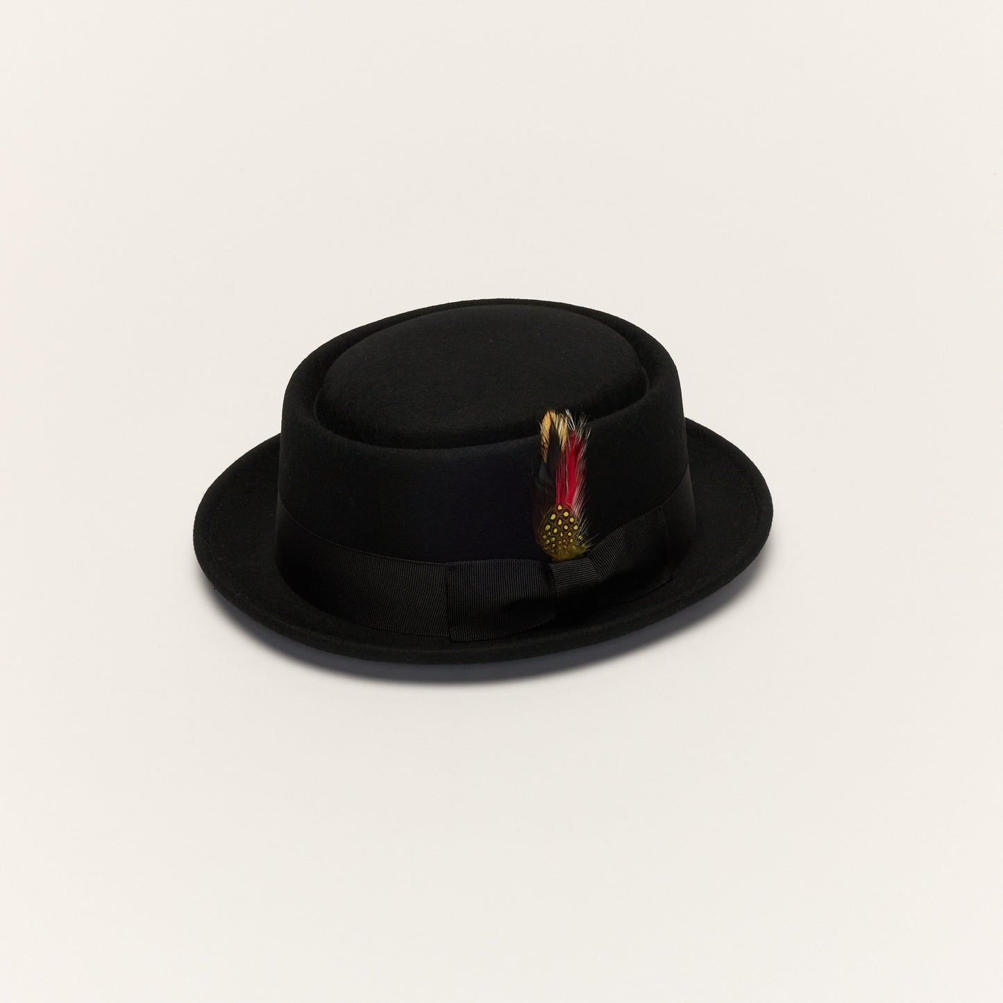 
                  
                    Black Pork Pie Hat with Feather Trim
                  
                