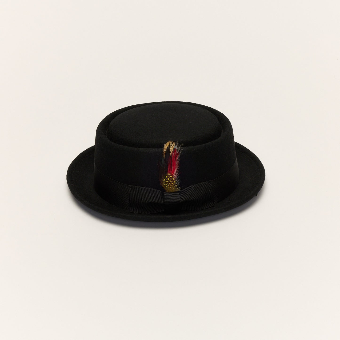 
                  
                    Black Pork Pie Hat with Feather Trim
                  
                