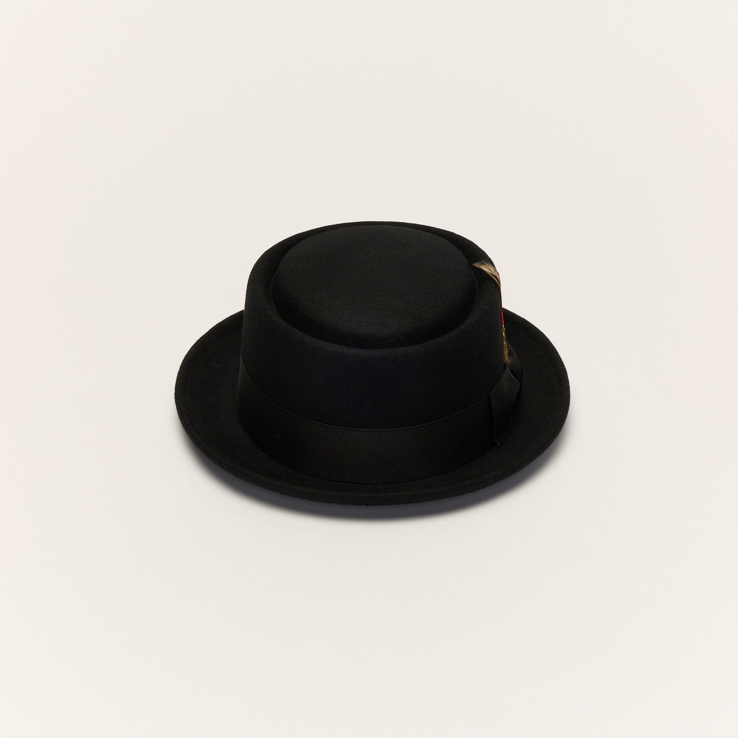
                  
                    Black Pork Pie Hat with Feather Trim
                  
                