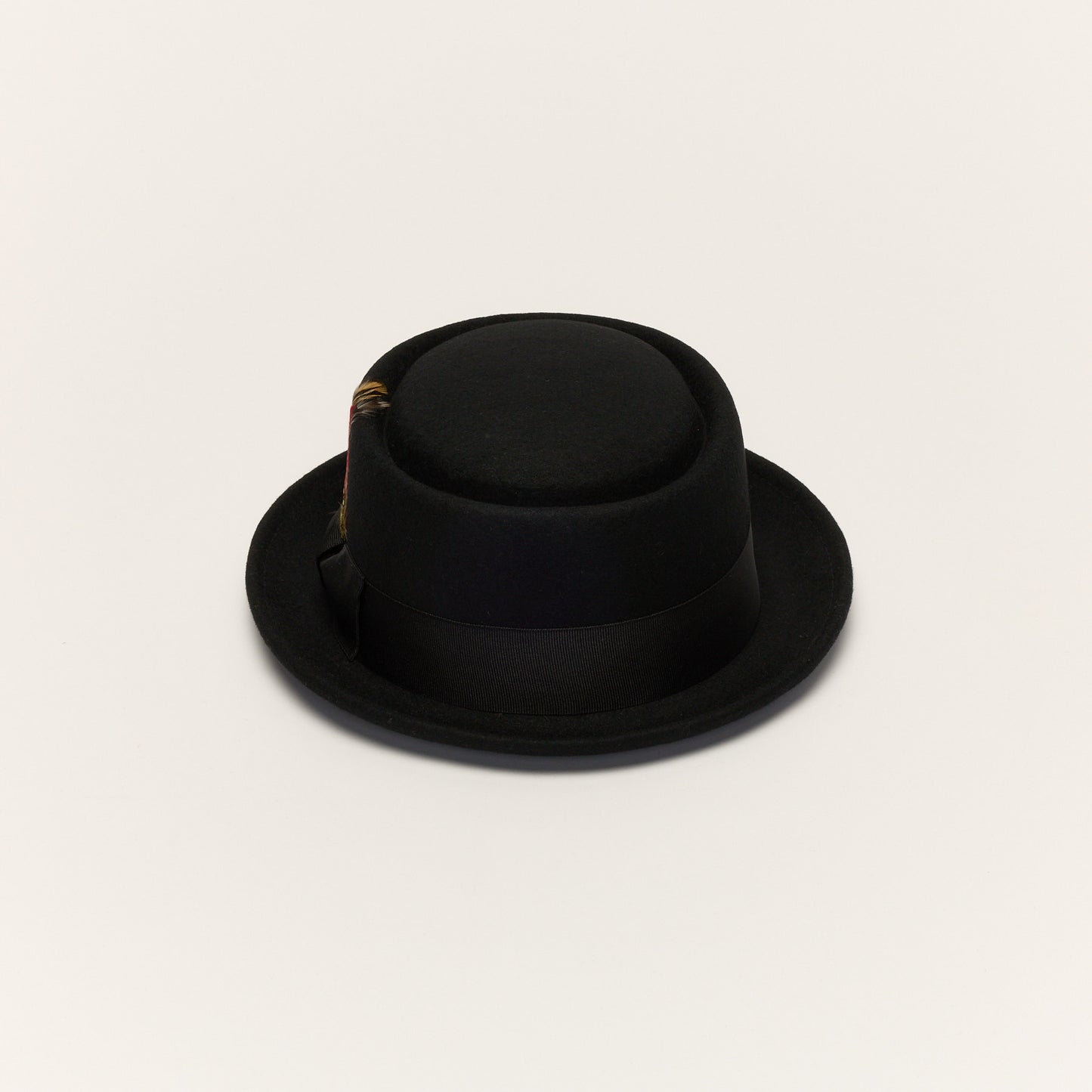 
                  
                    Black Pork Pie Hat with Feather Trim
                  
                