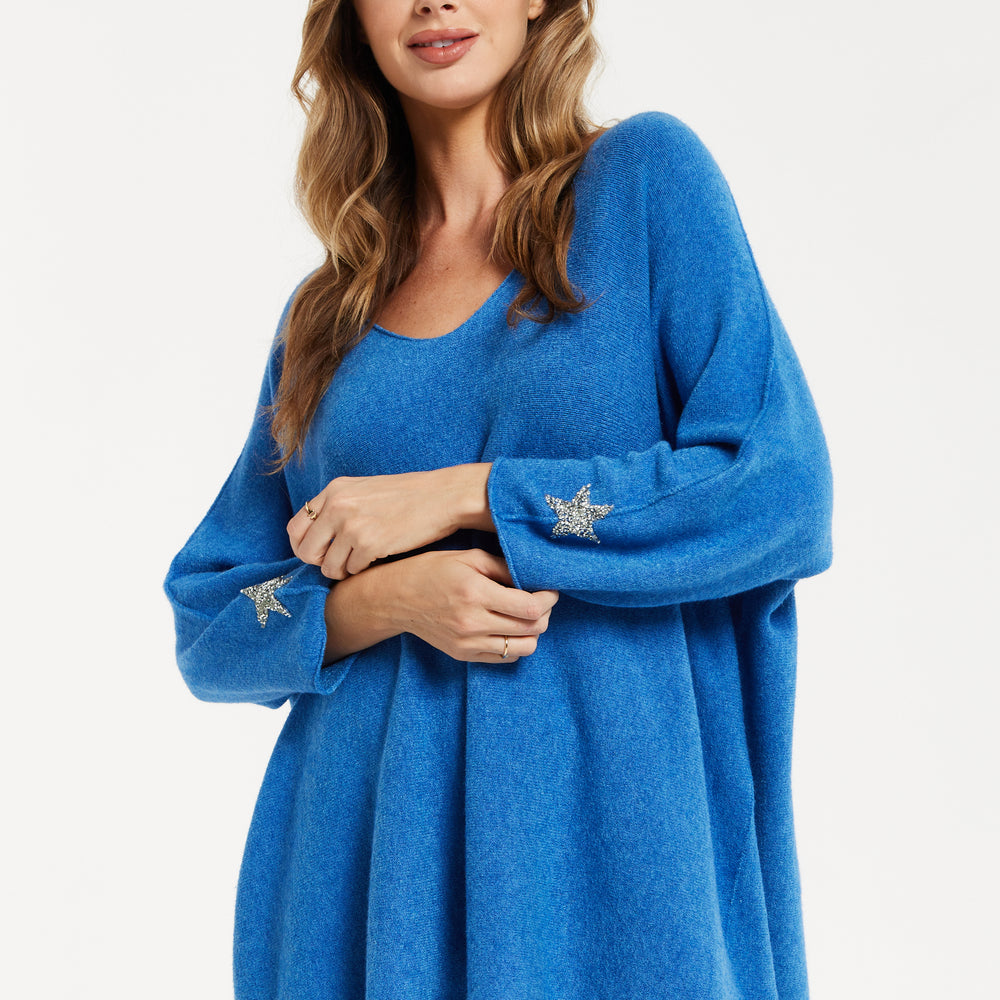 
                  
                    Liquorish Women's Blue Oversized V-Neck Jumper with Long Sleeves and Star Embellishments
                  
                