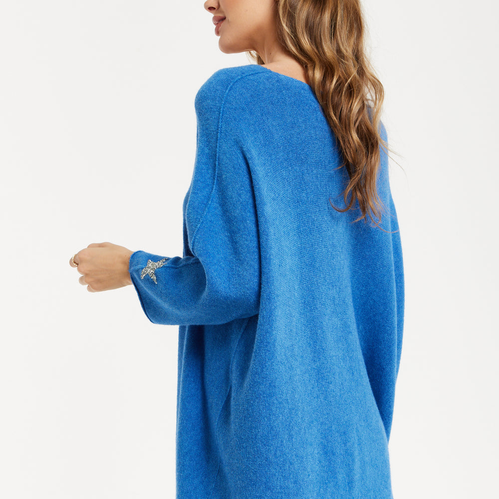 
                  
                    Liquorish Women's Blue Oversized V-Neck Jumper with Long Sleeves and Star Embellishments
                  
                