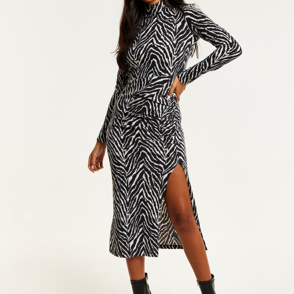 
                  
                    Liquorish Brushed Knit Mono Zebra Print Midi Dress With Front Slit
                  
                