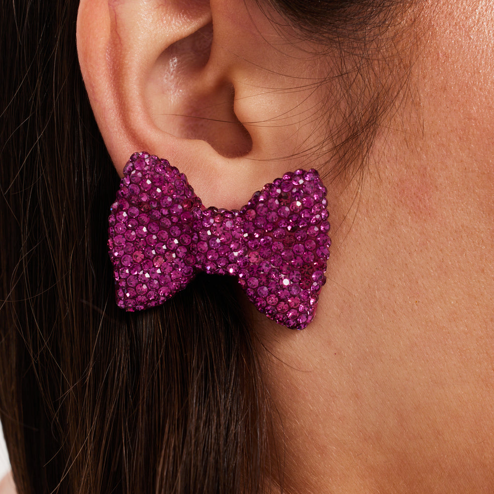 
                  
                    Liquorish Diamonte Bow Stud Earrings In Pink
                  
                