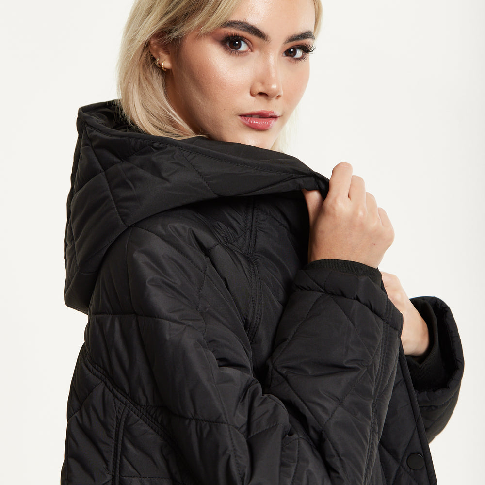 
                  
                    Black Quilted Oversized Hooded Coat
                  
                