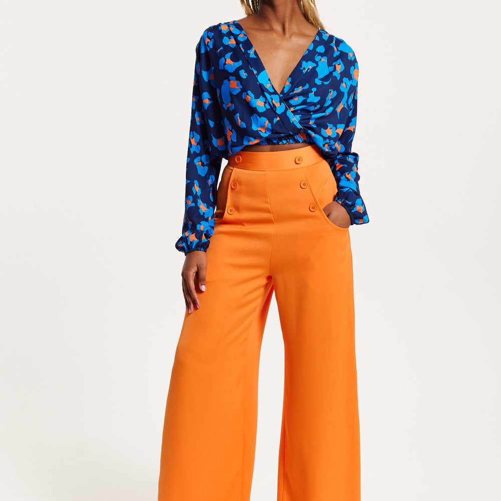 
                  
                    Liquorish Abstract Print Wrap Top In Pink Orange And Blue
                  
                