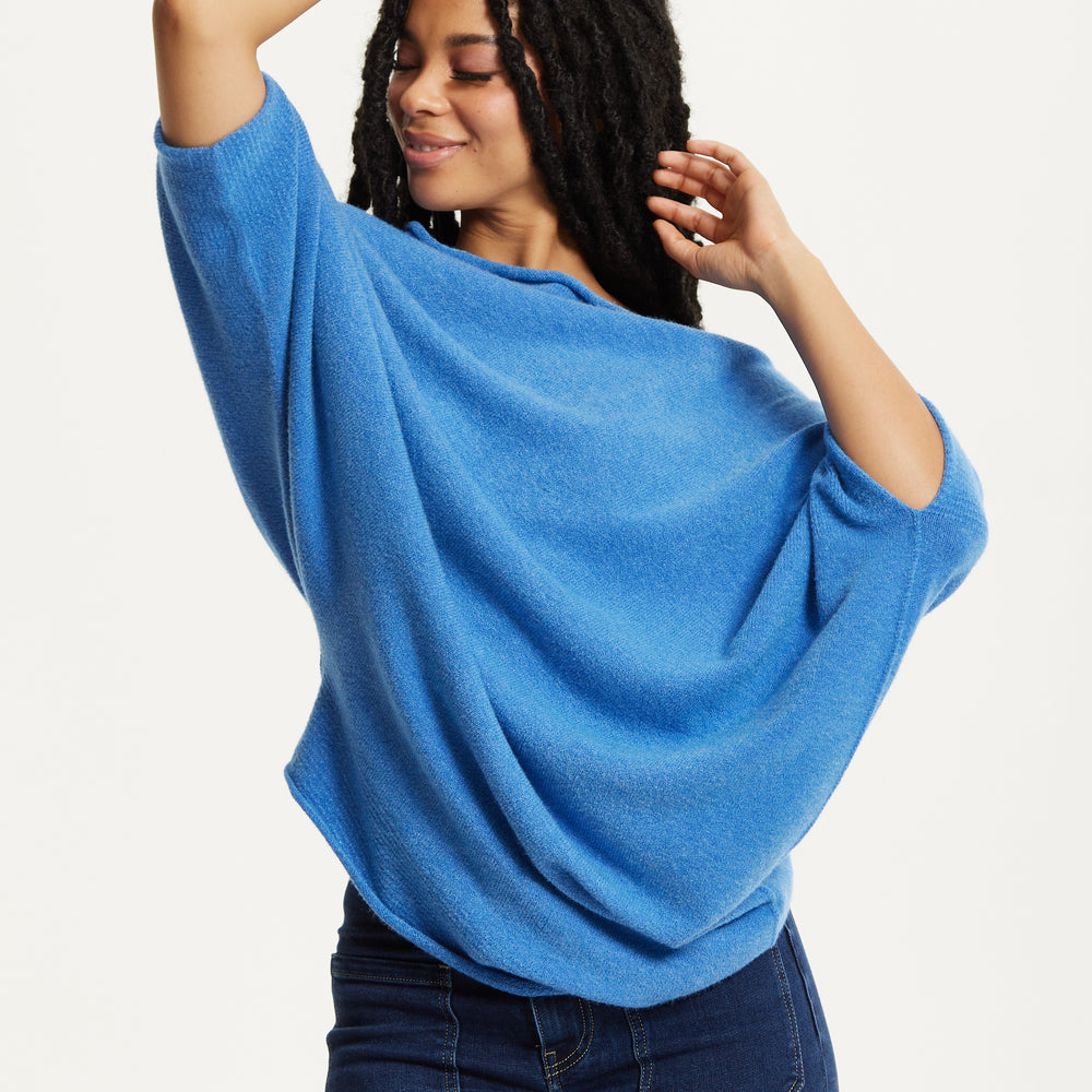 
                  
                    Blue Off-Shoulder Knit Poncho Top
                  
                