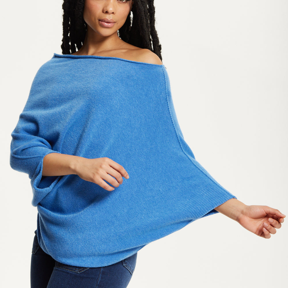 
                  
                    Blue Off-Shoulder Knit Poncho Top
                  
                