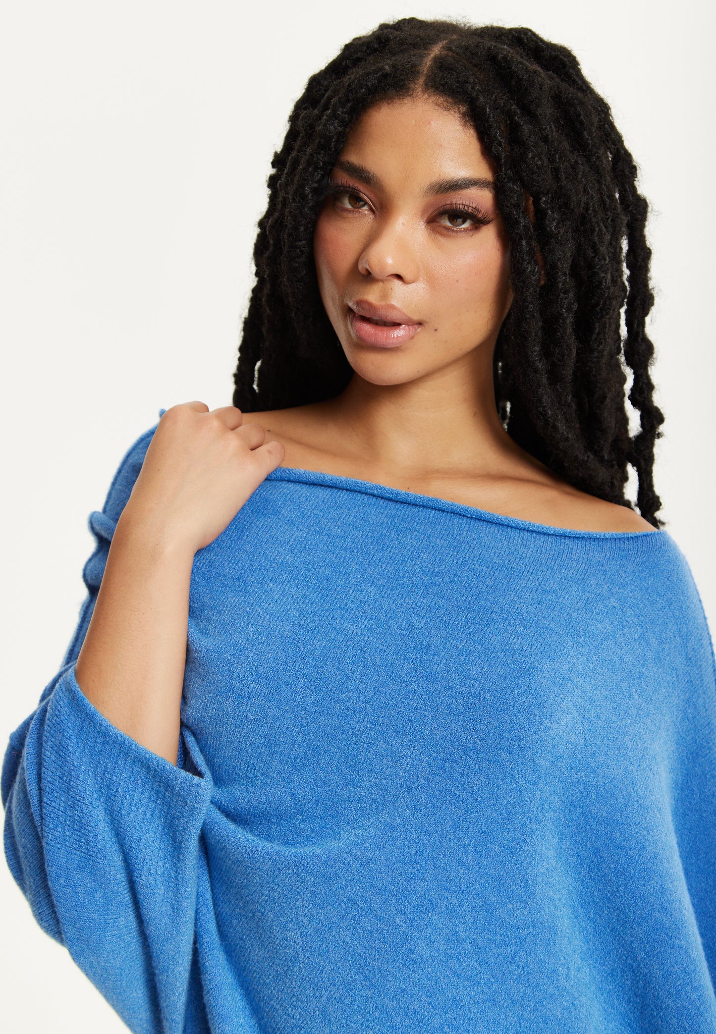 
                  
                    Blue Off-Shoulder Knit Poncho Top
                  
                