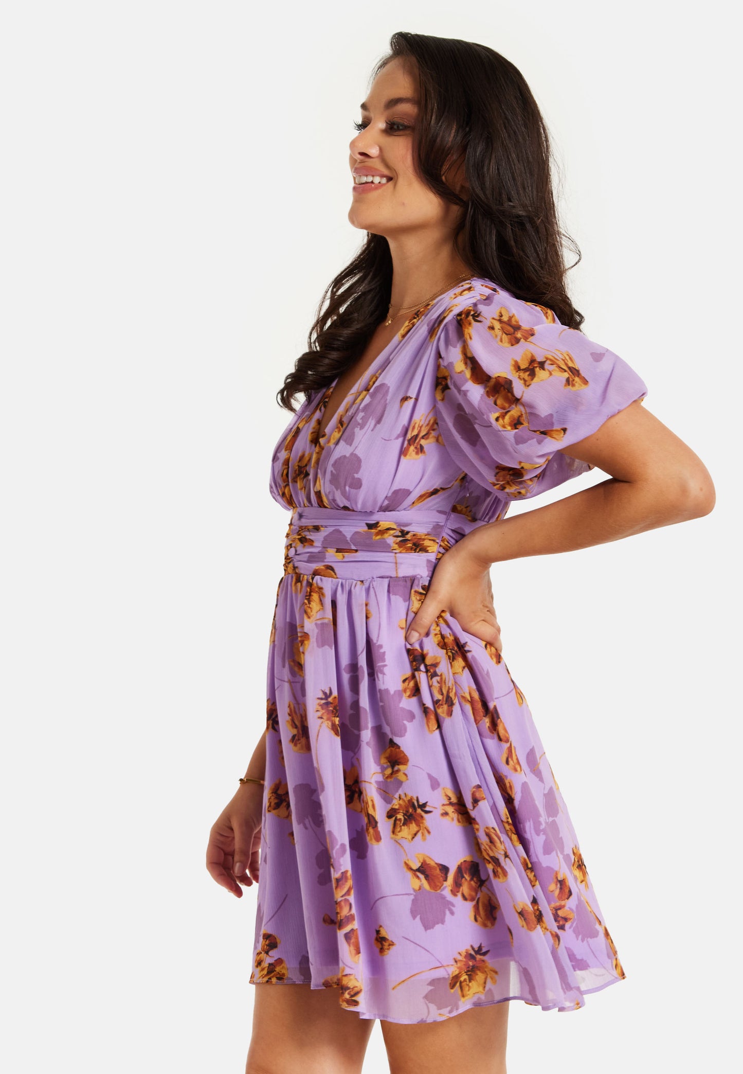 
                  
                    Women's Mini Dress in Purple Floral with Short Sleeves and Deep V Neck - Stylish Button Waistband by Liquorish
                  
                