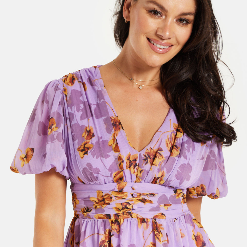 
                  
                    Women's Mini Dress in Purple Floral with Short Sleeves and Deep V Neck - Stylish Button Waistband by Liquorish
                  
                