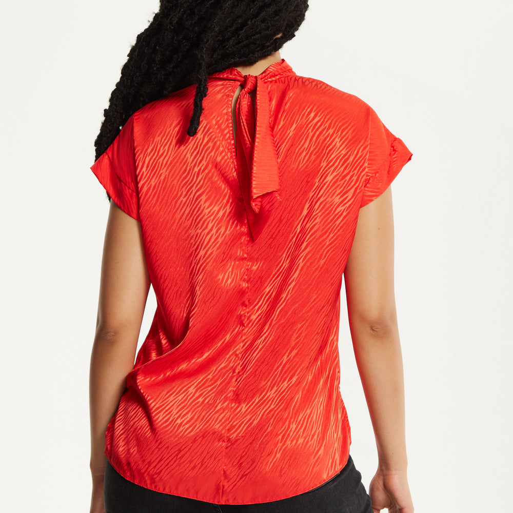 
                  
                    Red Satin Textured High Neck Top
                  
                