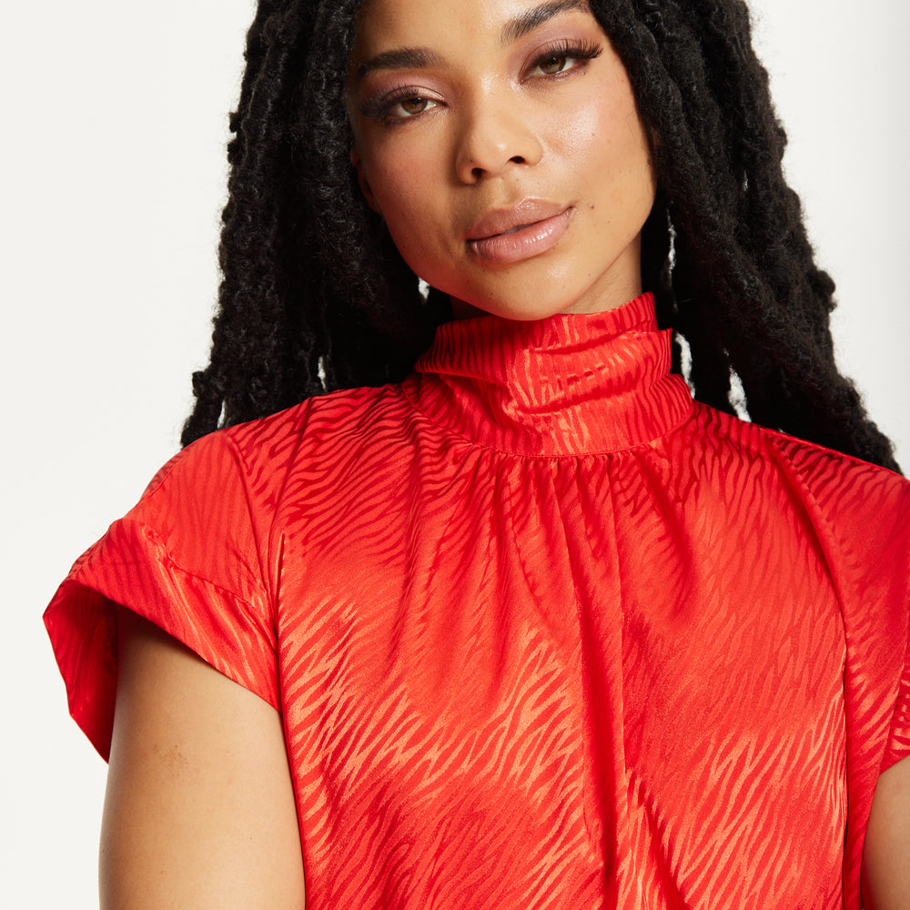 
                  
                    Red Satin Textured High Neck Top
                  
                