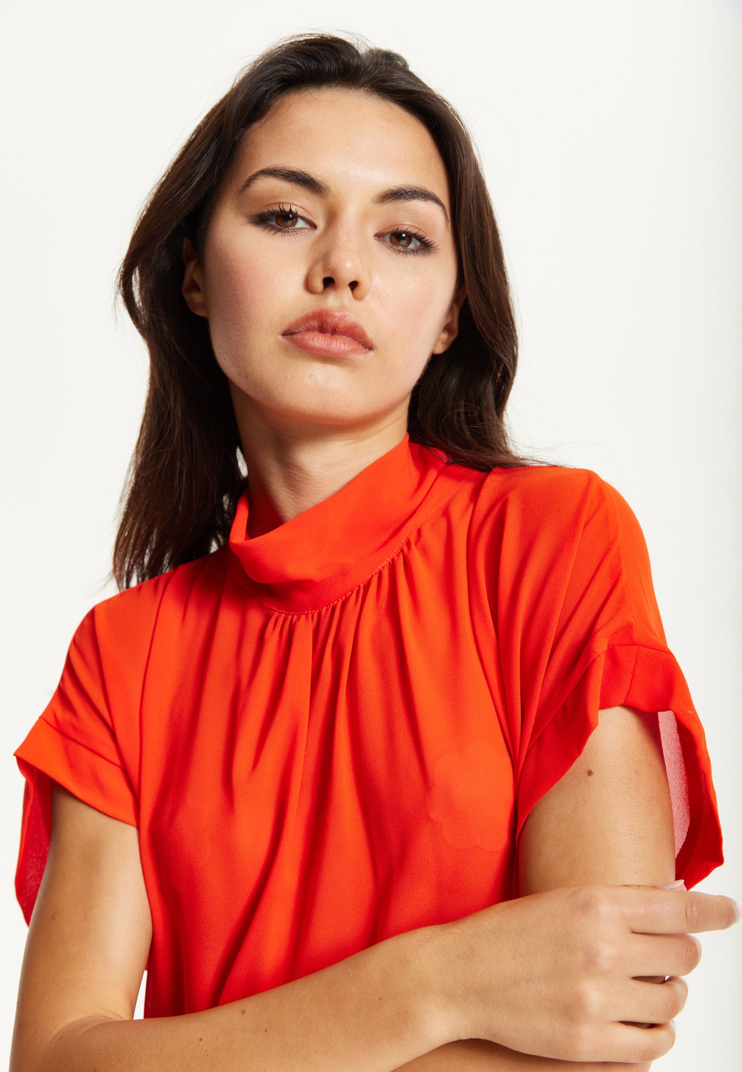 
                  
                    Orange High Neck Tie Back Top
                  
                