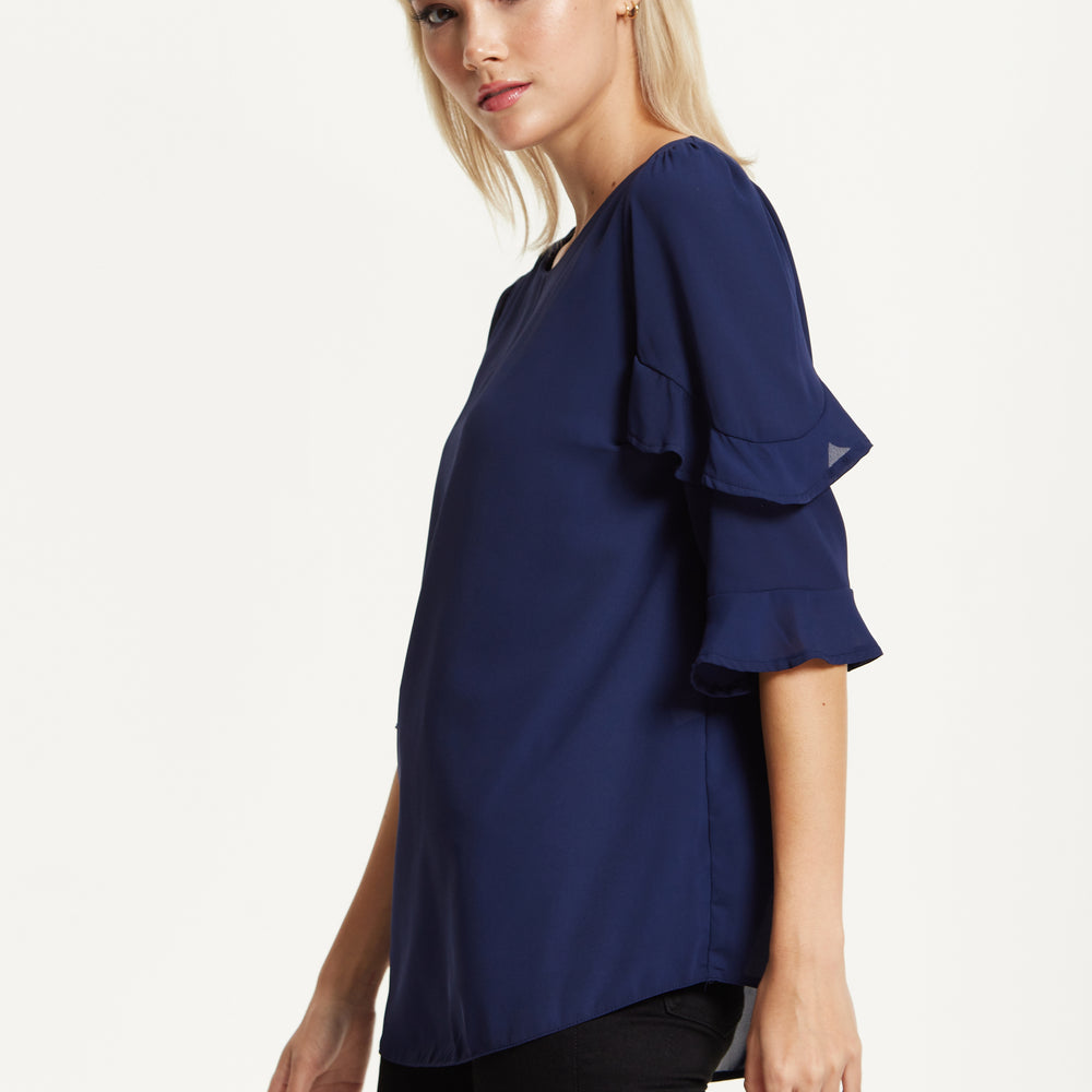 
                  
                    Navy Ruffle Sleeve Blouse
                  
                