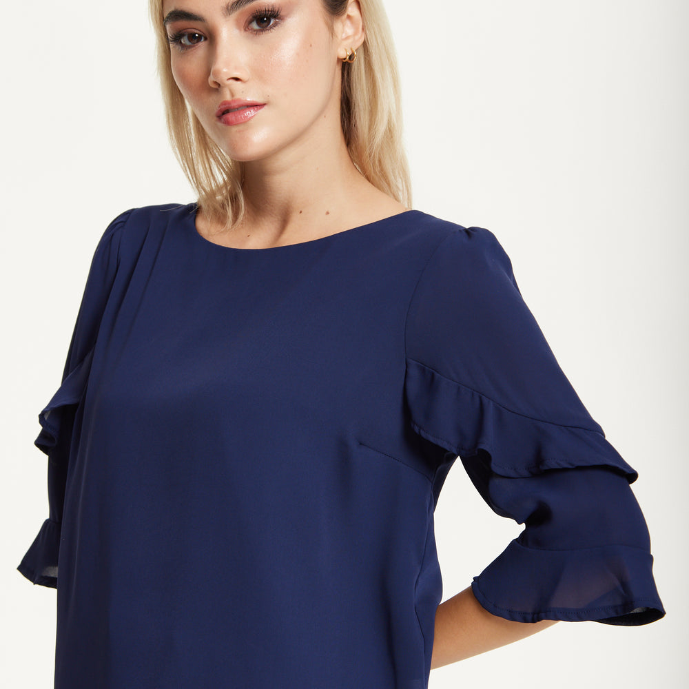 
                  
                    Navy Ruffle Sleeve Blouse
                  
                