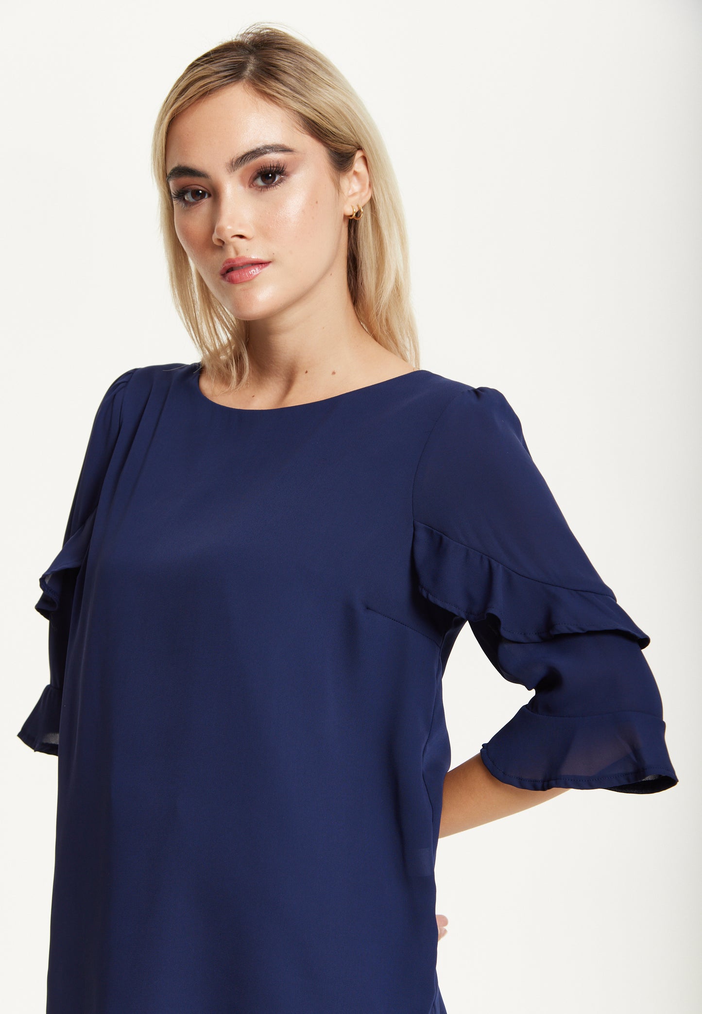 
                  
                    Navy Ruffle Sleeve Blouse
                  
                