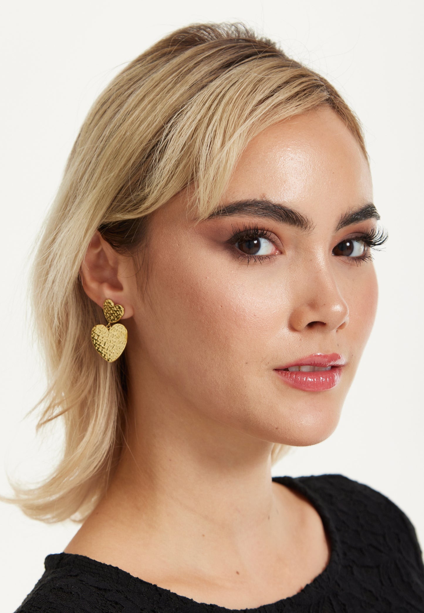 
                  
                    Gold Textured Double Heart Earrings
                  
                