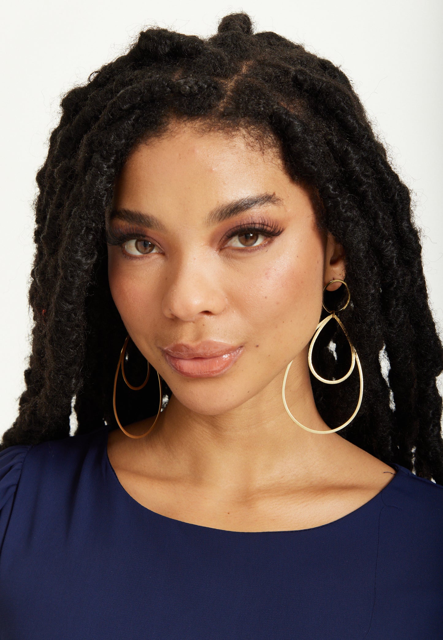 
                  
                    Gold Double Teardrop Statement Earrings
                  
                