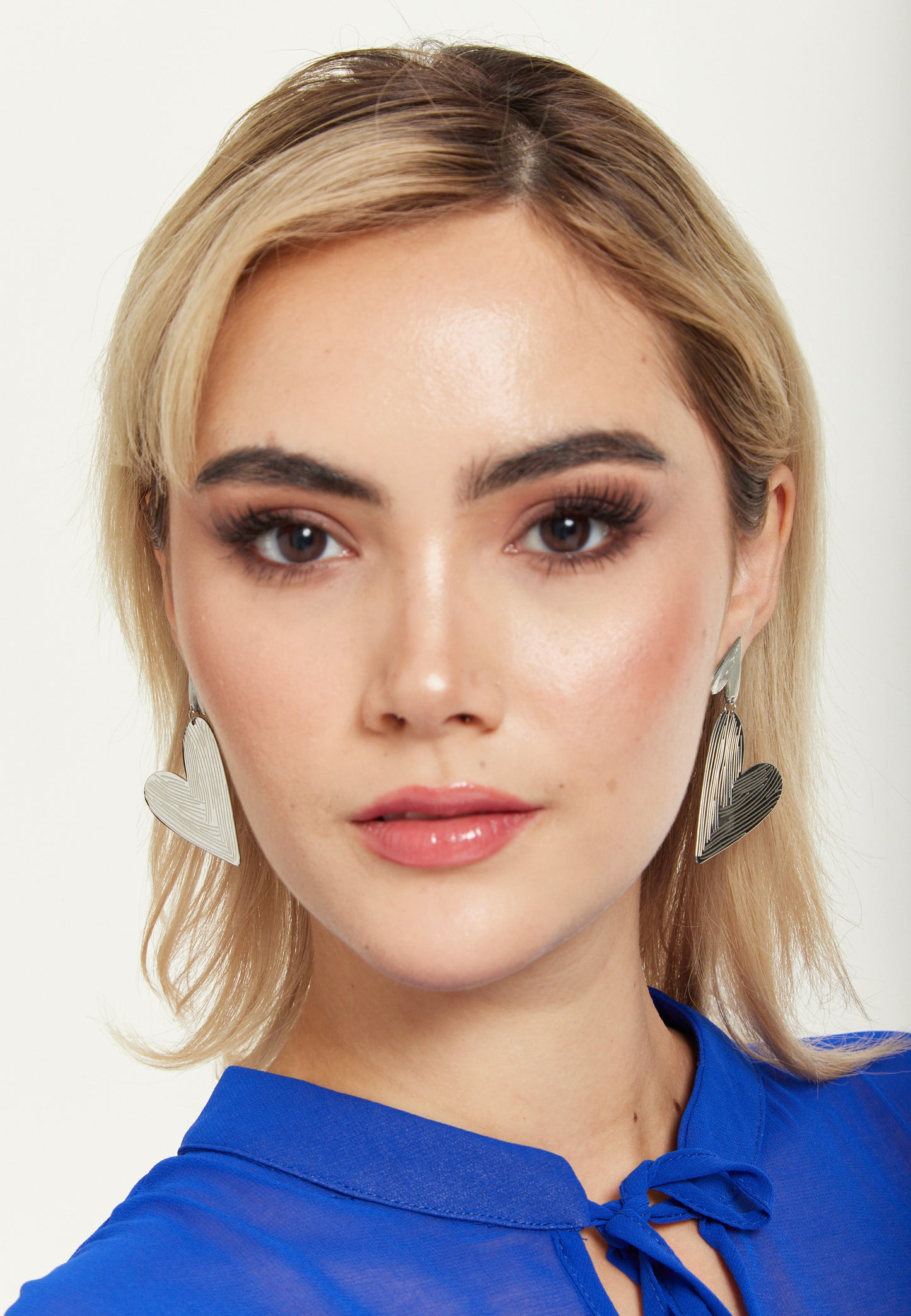 
                  
                    Silver Textured Double Heart Earrings
                  
                