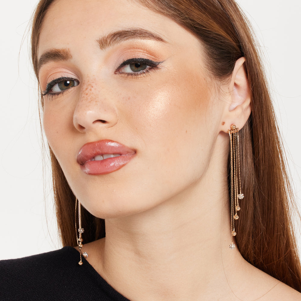 
                  
                    Gold Tassel Earrings with Rhinestone
                  
                