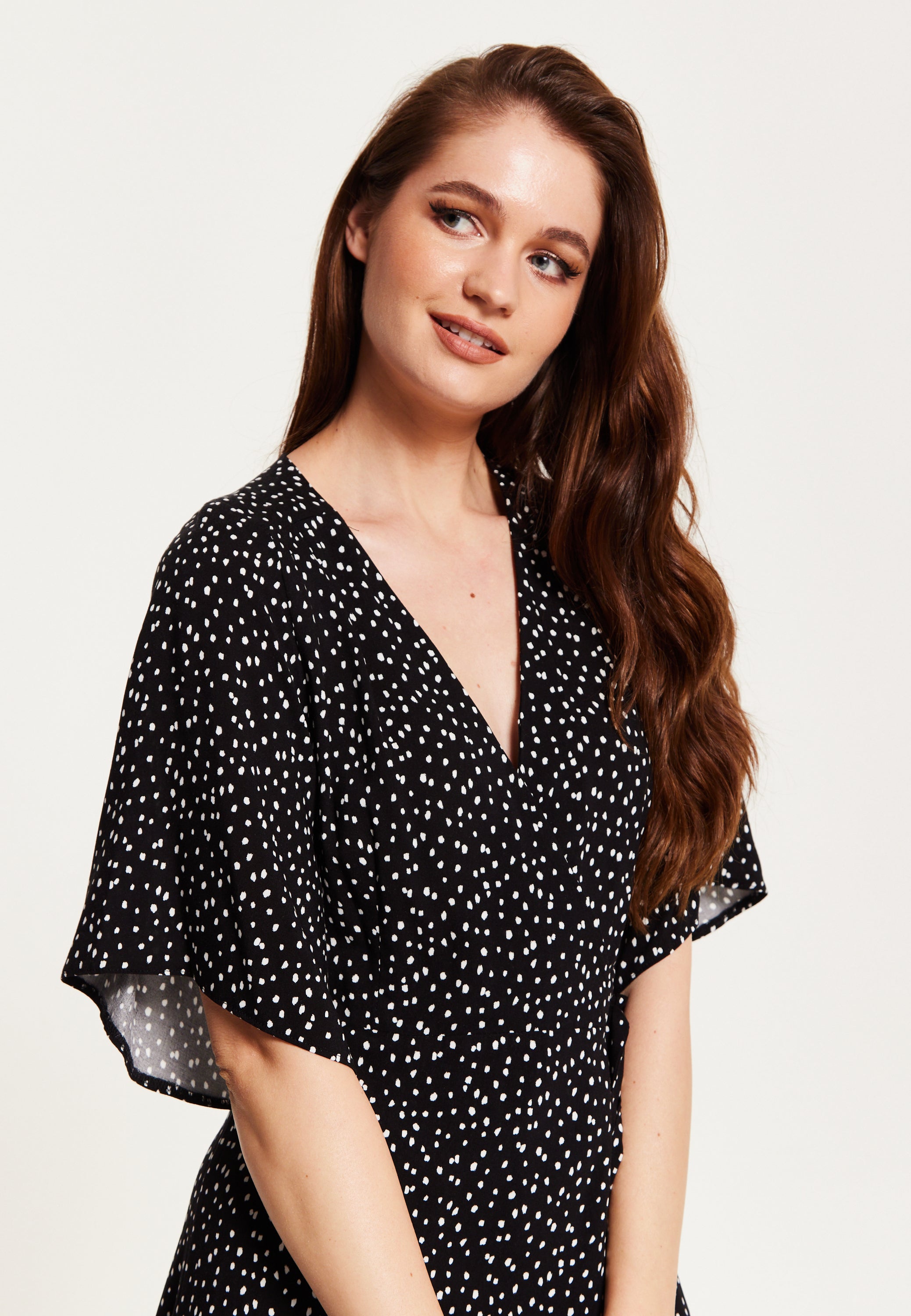 Black dress with polka dot sleeves hotsell