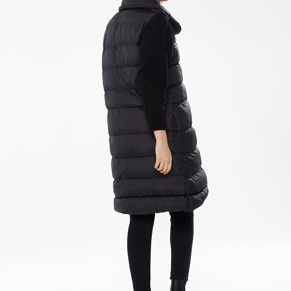 
                  
                    Women's Long Black Puffer Gilet with Asymmetric Button Closure, Drawstring High Neck, and Side Pockets for Ultimate Warmth
                  
                