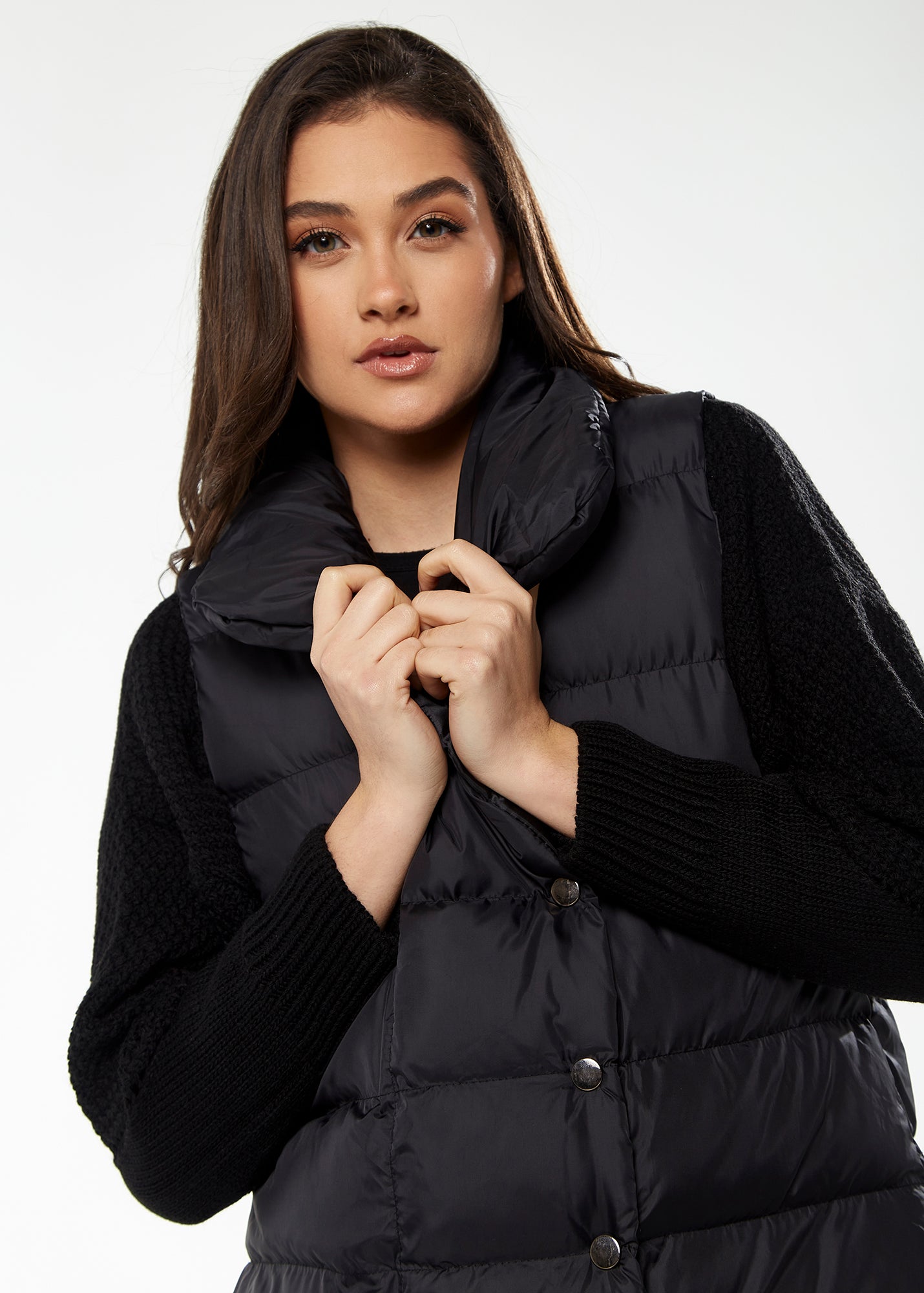 
                  
                    Women's Long Black Puffer Gilet with Asymmetric Button Closure, Drawstring High Neck, and Side Pockets for Ultimate Warmth
                  
                